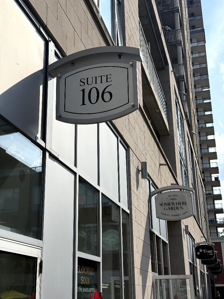 Suite 106 sign at 191 King Street South